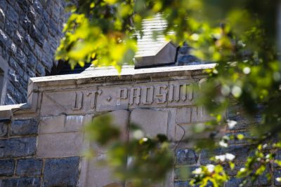 The university motto - Ut Prosim - is written in stone on an archway of East Campbell Hall